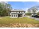 Two-story house back view with covered patio and large backyard at 2647 Old Snapping Shoals Rd, Mcdonough, GA 30252