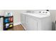 Laundry room with washer, dryer, and storage at 2647 Old Snapping Shoals Rd, Mcdonough, GA 30252