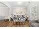 Living room featuring gray sofa and coffee table at 2647 Old Snapping Shoals Rd, Mcdonough, GA 30252
