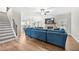 Open living space with large sectional sofa, hardwood floors and high ceilings at 2647 Old Snapping Shoals Rd, Mcdonough, GA 30252