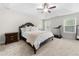 Spacious main bedroom with large windows and a treadmill at 2647 Old Snapping Shoals Rd, Mcdonough, GA 30252