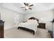 Main bedroom with a king-size bed and ceiling fan at 2647 Old Snapping Shoals Rd, Mcdonough, GA 30252