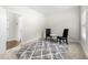 Cozy office space with two chairs, a small table, and an area rug at 2647 Old Snapping Shoals Rd, Mcdonough, GA 30252