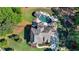 A luxurious home with extensive landscaping and outdoor entertaining areas, as seen from an aerial view at 5330 Lake Redwine Nw Cv, Acworth, GA 30101