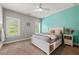 Bright bedroom with a ceiling fan, carpet, and a window providing lots of natural light at 5330 Lake Redwine Nw Cv, Acworth, GA 30101
