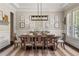 Formal dining room featuring a wooden table set for eight with elegant decor at 5330 Lake Redwine Nw Cv, Acworth, GA 30101