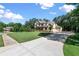 Well-maintained home with a large front yard, long driveway, and mature trees, offering ample space and privacy at 5330 Lake Redwine Nw Cv, Acworth, GA 30101