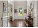 Bright and airy foyer featuring hardwood floors, white wainscoting, and a view of the landscaped front yard at 5330 Lake Redwine Nw Cv, Acworth, GA 30101
