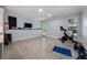 Spacious home gym with ample natural light and access to the outdoors at 5330 Lake Redwine Nw Cv, Acworth, GA 30101