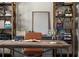 Cozy home office featuring custom wood shelving and a leather desk chair at 5330 Lake Redwine Nw Cv, Acworth, GA 30101