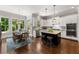 Gourmet kitchen featuring a large island, white cabinets, and a breakfast nook at 5330 Lake Redwine Nw Cv, Acworth, GA 30101