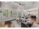 Open concept living room with coffered ceilings and kitchen view at 5330 Lake Redwine Nw Cv, Acworth, GA 30101