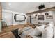 Home theater living room with a bar area, projector, and comfortable sectional sofa at 5330 Lake Redwine Nw Cv, Acworth, GA 30101