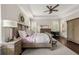 Spacious main bedroom with hardwood floors, plantation shutters, tray ceiling, and ample natural light at 5330 Lake Redwine Nw Cv, Acworth, GA 30101