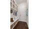 Well-organized mudroom with built-in storage, bench seating, and stylish decor at 5330 Lake Redwine Nw Cv, Acworth, GA 30101