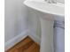 Classic pedestal sink in updated half bathroom at 970 Samples Nw Ln, Atlanta, GA 30318