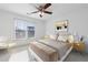 Bedroom with taupe bedding and a sitting chair at 970 Samples Nw Ln, Atlanta, GA 30318