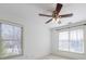 Bedroom with ceiling fan and two windows at 970 Samples Nw Ln, Atlanta, GA 30318