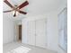 Bright bedroom with ceiling fan and double doors at 970 Samples Nw Ln, Atlanta, GA 30318