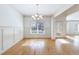 Bright dining room with hardwood floors, chandelier and access to patio at 970 Samples Nw Ln, Atlanta, GA 30318