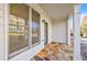 Inviting front porch with stone flooring and access to the home at 970 Samples Nw Ln, Atlanta, GA 30318