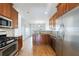 Modern kitchen with stainless steel appliances and wood cabinets at 970 Samples Nw Ln, Atlanta, GA 30318