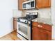 Stainless steel oven and gas cooktop in this updated kitchen at 970 Samples Nw Ln, Atlanta, GA 30318