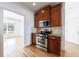 Modern kitchen with stainless steel appliances and wood cabinets at 970 Samples Nw Ln, Atlanta, GA 30318