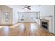 Sunlit living room with hardwood floors, fireplace and multiple windows at 970 Samples Nw Ln, Atlanta, GA 30318