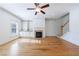 Spacious living room featuring hardwood floors, fireplace and ceiling fan at 970 Samples Nw Ln, Atlanta, GA 30318