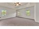 Large main bedroom with carpet and tray ceiling at 2217 Spring Stone Ct, Buford, GA 30519