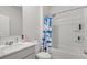 Clean bathroom with a shower/tub combo and white vanity at 2732 Piper Dr, Atlanta, GA 30331