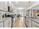 Modern kitchen with granite countertops, stainless steel appliances, and island at 2732 Piper Dr, Atlanta, GA 30331