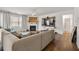 Spacious living room with L-shaped sofa, fireplace, and hardwood floors at 2732 Piper Dr, Atlanta, GA 30331