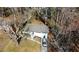 Ranch house nestled in a wooded area with a driveway at 1394 Yates Ave, Austell, GA 30106