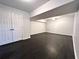 Finished basement with double doors and dark floors at 1394 Yates Ave, Austell, GA 30106
