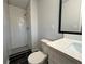 Updated bathroom with white vanity and walk-in shower at 1394 Yates Ave, Austell, GA 30106
