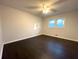 Spacious bedroom with dark hardwood floors and ceiling fan at 1394 Yates Ave, Austell, GA 30106