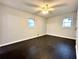 Bright bedroom with dark hardwood floors and ceiling fan at 1394 Yates Ave, Austell, GA 30106