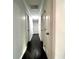 Hallway with dark hardwood floors and white doors at 1394 Yates Ave, Austell, GA 30106