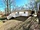 White brick house with deck and grassy yard at 1394 Yates Ave, Austell, GA 30106