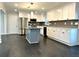Modern white kitchen with gray island and stainless steel appliances at 1394 Yates Ave, Austell, GA 30106