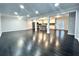 Open living room with dark hardwood floors, recessed lighting, and an island kitchen at 1394 Yates Ave, Austell, GA 30106