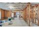 Unfinished basement with exposed framing, insulation, and concrete floors, offering a customizable space at 4595 Carriage Walk Ln, Cumming, GA 30040
