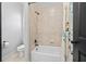 Bathroom with a bathtub, ceramic tiled walls, and curtain at 4595 Carriage Walk Ln, Cumming, GA 30040