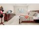 Spacious bedroom with a dresser, TV, and plantation shutters, offering a serene retreat at 4595 Carriage Walk Ln, Cumming, GA 30040