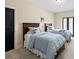 Bedroom with two matching beds with neutral walls, carpet and a black door at 4595 Carriage Walk Ln, Cumming, GA 30040