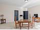 Spacious bonus room with neutral walls and carpet, window shutters, and a table with chairs at 4595 Carriage Walk Ln, Cumming, GA 30040