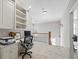 Upstairs landing featuring built-in bookshelves and a home office, creating a functional and stylish workspace at 4595 Carriage Walk Ln, Cumming, GA 30040