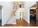 Grand two-story entryway with hardwood floors and elegant staircase at 266 Mossy Nw Way, Kennesaw, GA 30152